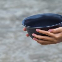 Boy with empty bowl